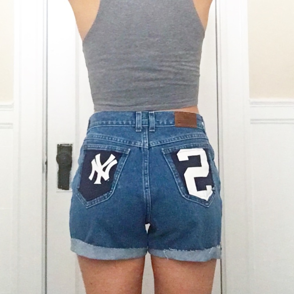 Vintage Lee high-waisted cutoffs w/ Yankees decal
